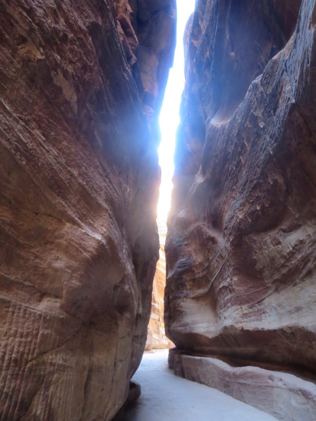 Looking up between the rock walls towards the sky as we pass through the siq in the afternoon